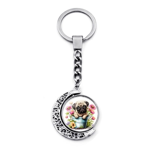 Porte-clés lune rotatif argenté avec illustration de carlin et fleurs roses