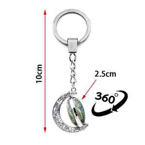 Porte-clés oiseau avec pendentif lune rotatif en métal argenté pour sacs et voitures