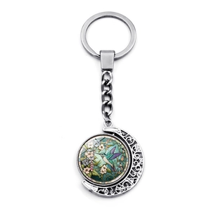 Porte-clés rotatif avec pendentif lune colibri et illustrations florales