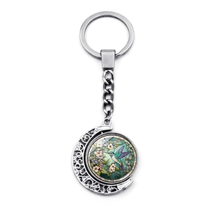 Porte-clés en métal avec pendentif lune rotatif double face motif colibri et gemme du temps