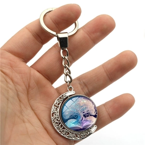 Rotating moon keychain with Tree of Life art glass pendant on a silver metal frame