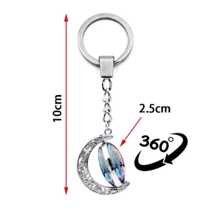 Rotating silver moon keychain with Tree of Life galaxy pattern, 360-degree swivel design