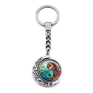 Rotating Yin Yang Tai Chi keychain with hollow moon pendant in silver finish