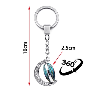 Porte-clés lune et hippocampe rotatif en métal argenté avec texture colorée de 10cm