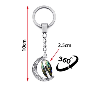 Rotating crescent moon keychain with colorful bumblebee pattern glass cabochon