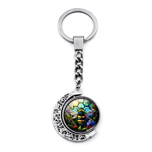 Artistic moon-shaped metal keychain with rotating colorful honey bee glass pendant