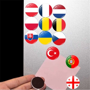 Close-up of glass crystal fridge magnet with national flag design and magnetic backing