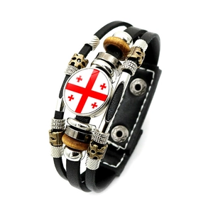 Detail view of woven leather bracelet featuring Georgia flag glass charm and metal clasp