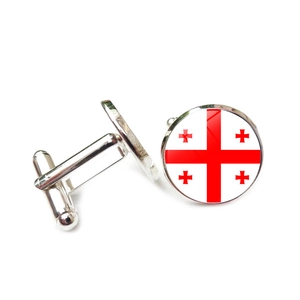 Detailed close-up of silver-tone cufflinks featuring the Georgia flag under glass