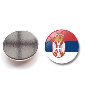 Macro detail of round Serbia flag glass magnet showing front design and back magnetic surface