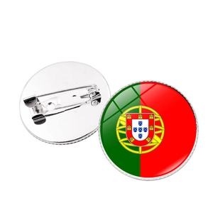 Close-up of Portugal flag glass dome pin badge showing front design and back safety pin