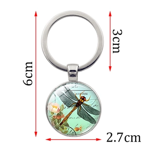 Vintage dragonfly key ring with glass pendant showing 6cm height and 3cm diameter details
