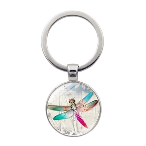 Vintage dragonfly art glass cabochon keychain with silver metal ring on white background