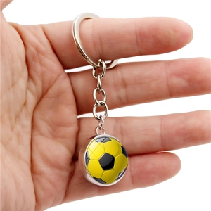 Classic soccer ball keychain with yellow and black football pattern on silver metal ring