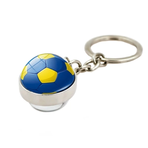 Close-up of blue and yellow soccer glass dome pendant on a silver metal keychain
