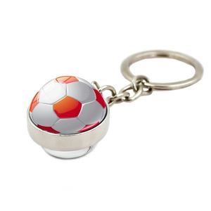 Close-up of a soccer pattern glass ball keychain with a polished silver metal ring