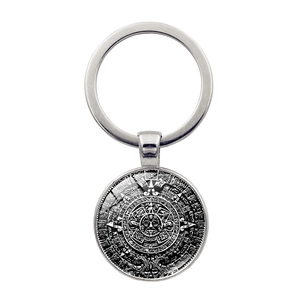 Vintage Aztec Sun Calendar keychain with silver alloy base and glass cabochon pendant