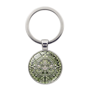 Detailed macro view of Aztec Sun Stone calendar pendant with silver metal key ring
