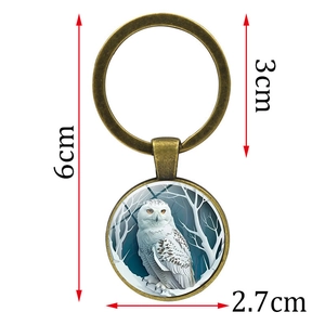 Vintage bronze owl keychain with white owl glass pendant and snow forest design