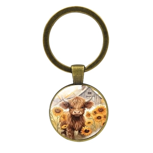 Porte-clés cabochon verre avec vache d'Écosse et tournesol sur anneau en métal bronze
