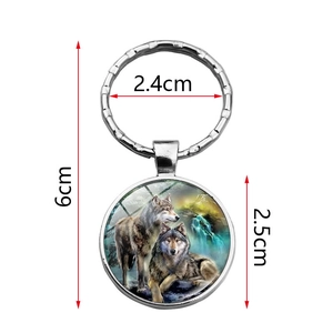 Wolf pattern glass cabochon keychain with silver zinc alloy ring and nature scenery