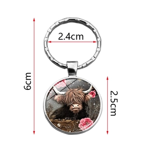 Silver highland cow keychain with pink floral art pattern and size measurements