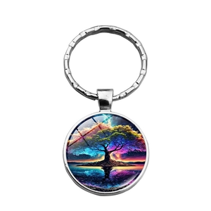 Artistic Tree of Life keychain with colorful dreamlike starry sky illustration in silver frame