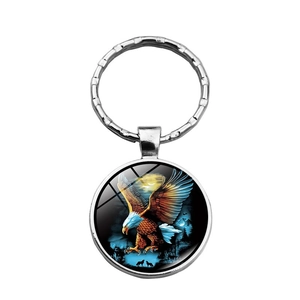 Eagle and wolf glass gem keychain with silver metal ring on a white background