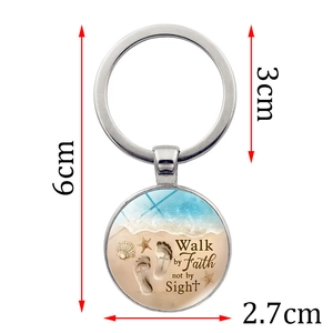 Walk By Faith Not By Sight metal keychain with a beach theme glass dome pendant