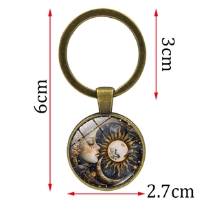 Vintage bronze sun and moon glass cabochon keychain with 6cm total length and artistic design