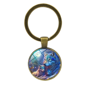 Portachiavi vintage in bronzo con lupo e luna e cupola in vetro scena forestale