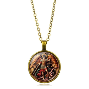 Close-up of Archangel Saint Michael defeating demon on vintage bronze pendant necklace