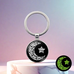 Luminous moon and star keychain with silver alloy finish and glowing mandala glass pendant