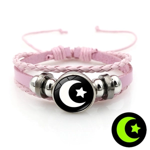 Luminous sun moon leather bracelet with pink woven layers and glowing glass pendant