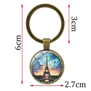 Vintage bronze Eiffel Tower keychain with artistic glass pendant and size specifications