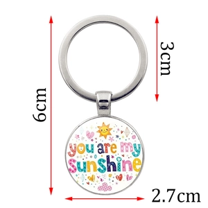 Porte-clés You Are My Sunshine avec pendentif rond en métal et motif de soleil coloré
