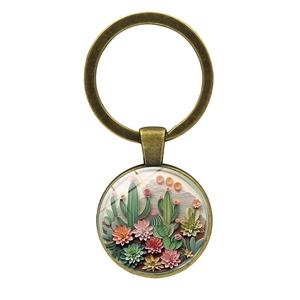 Portachiavi vintage in bronzo con cactus e piante succulente in micro-paesaggio floreale