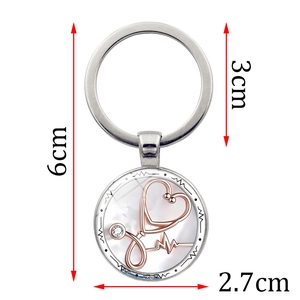 Stethoscope and heart pendant keychain with medical theme design on white background