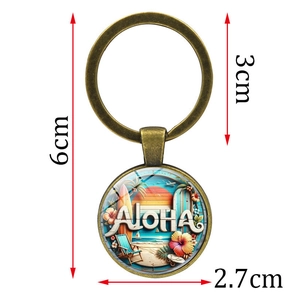 Retro bronze Aloha keychain with a beach surfing scene pendant featuring palm trees