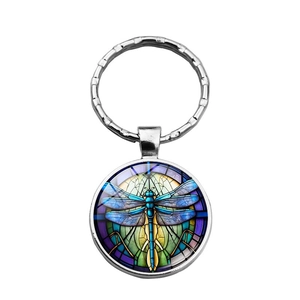 Detail of steampunk dragonfly time gem keychain with stained glass style pendant
