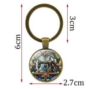 Porte-clés en verre avec motif machine à coudre rétro et finition bronze pour sacs femme