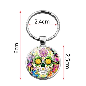 Mexican sugar skull keychain with colorful glass gem pendant and silver metal ring