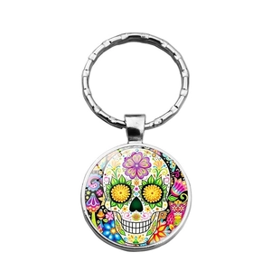 Mexican sugar skull keychain with colorful floral art and silver metal ring accessory