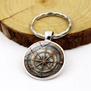 Porte-clés boussole nautique vintage avec anneau en métal et dôme de verre
