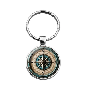 Vintage nautical compass keychain with silver metal ring and blue glass pendant design
