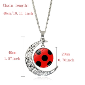 Detailed size view of crescent moon pendant with red polka dots and dimensions