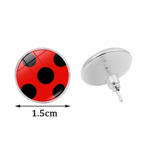 Detailed view of red polka dot stud earrings with 1.5cm diameter silver metal base
