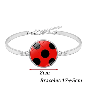 Polka dot charm bracelet with 2cm glass pendant and adjustable 17cm extension chain
