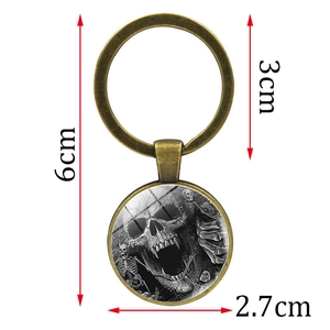 Porte-clés gothique punk avec crâne en bronze et pendentif en verre longueur 6cm