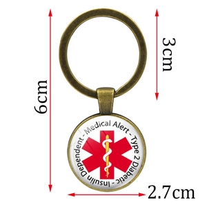 Bronze diabetic medical alert keychain with Star of Life symbol and size measurements